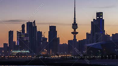 Seaside skyline of Kuwait city from night to day timelapse