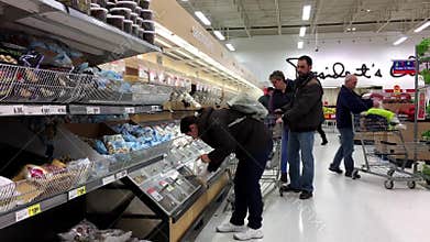 Motion of people picking fod at bulk foods section