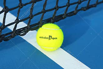 Wilson tennis ball with Australian Open logo on tennis court at Australian tennis center in Melbourne Park