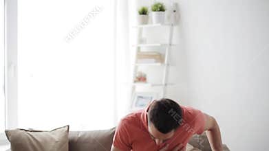 Unhappy man suffering from heart ache at home