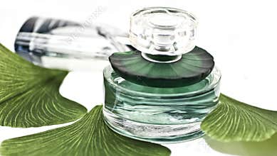 Bottles of perfume with the leaves