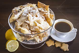 Sprinkle with powdered sugar, fried plate of shortcake dough. Dessert Polish and Lithuanian cuisine - faworki angel wings .