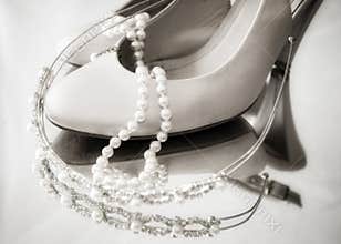 High heel shoes and pearls and tiarra