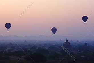 Balloons across the Bagan in sunrise