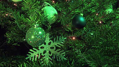New Year`s ball against the background of the decorated garland of a Christmas tree