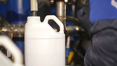 A canister with a dangerous liquid at the plant