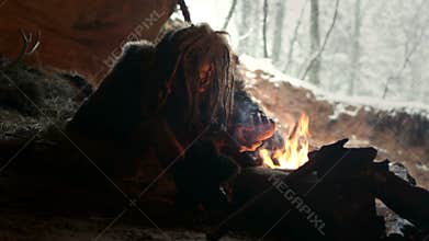 Prehistoric caveman in his cave