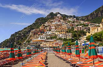 Summertime seascape. Amalfi coast: Positano beach: the skyline of the town. Italy Campania.