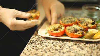 Stuffed tomatoes placed on a plate in restaurant