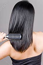 Woman Brushing Her Hair