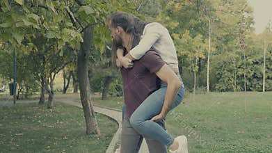 Girlfriend jumps in her boyfriend back