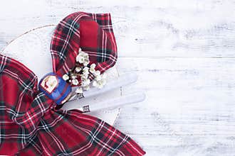 Cutlery, tablecloths and napkins for celebrating Christmas. Free space for text
