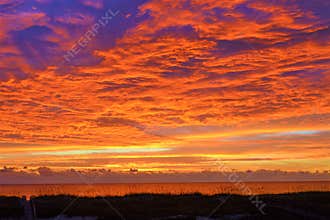 The sunrise colors are amazingly vivid and mixed with deep blues and orange