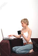 Beautiful woman browsing www on laptop