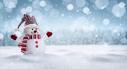 Happy snowman in winter secenery