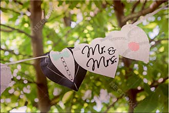 Mr. and Mrs. wedding sign on the flags, toned.