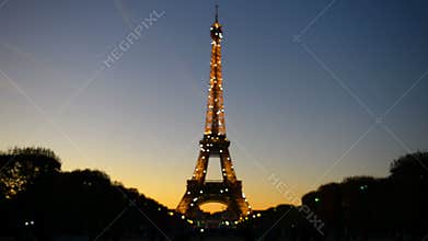 Illuminated Eiffel tower with sparkle lights at night in Paris