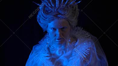 Scary Snow Queen turns around with the creepy stare