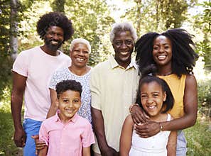 Multi generation black family in a forest, close up portrait