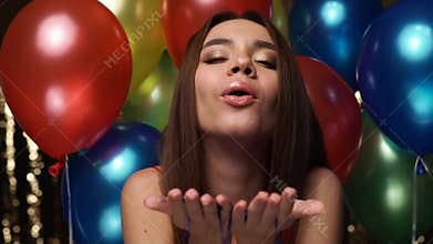 Birthday Party. Smiling Woman Blowing Glitter Near Balloons
