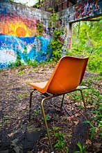 Orange chair in abandoned building