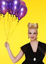 lady with a bunch of purple balloons