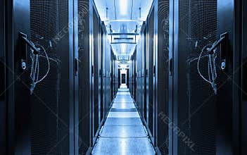 Dark blue data centre interior with rows of hardware equipment. Specialized building for hosting server and network equipment and