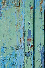 Texture of metal rust old. The background is blue, reddish and light green.