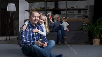 Daughter kissing and hugging dad expressing love