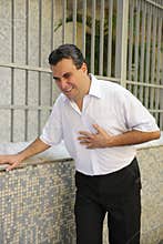 Man having a heart attack bending