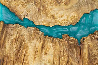 epoxy resin Stabilizing Afzelia burl exotic wood red background, Abstract art picture photo