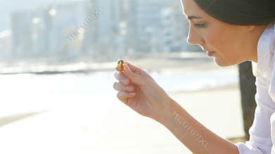 Sad wife looking her wedding ring after divorce