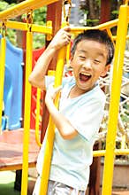 A child climbing a jungle gym.