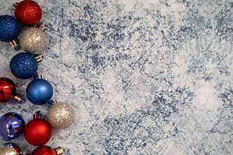 American USA patriotic flatlay Christmas holiday background with ornaments in red white and blue colors. Useful for Christmas in J