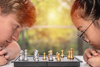 Teenager playing chess board together