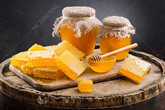 Jars of honey and honeycombs