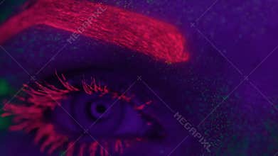 Woman with UV fluorescent makeup