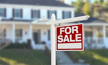 Nice Home For Sale Real Estate Sign in Front of Beautiful New House.