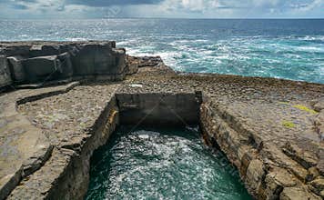 The famous `Wormhole` Poll na bPeist in gaelic in Inishmore, Aran Islands, Ireland