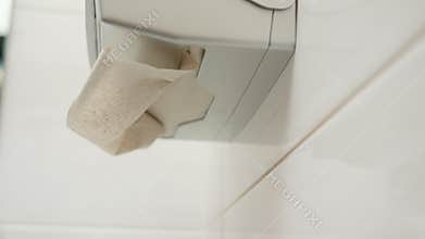 Hand Picking a Paper Towel