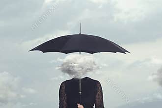 Woman with cloud head sheltering herself from the rain with umbrella