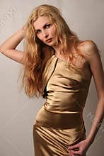 caucasian girl in gold dress