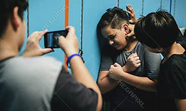 Teens bullying in the hallway