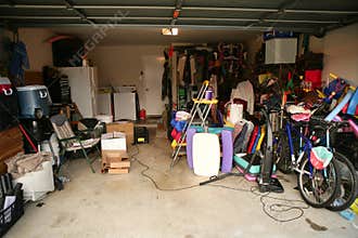 Messy abandoned garage full of stuff