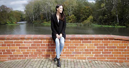 Woman on bridge enjoying weather