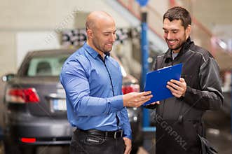 Auto mechanic and customer at car shop