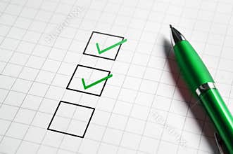 Checklist and to do list with v sign check marks in square box.