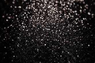 Black glitter sparkle background. Black friday shiny pattern with sequins. Christmas glamour luxury pattern, black