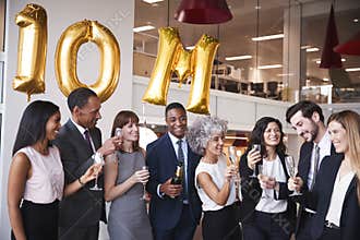 Business people celebrate meeting target in the office