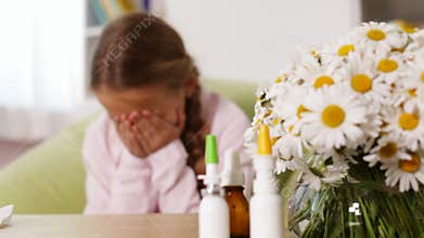 Girl with allergy blowing nose and sneezing